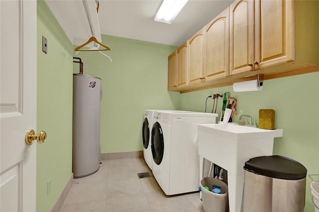 222 Schenley Rd, Squirrel Hill, PA 15217 - laundry area featuring water heater, cabinet space, light tile patterned flooring, baseboards, and washer and dryer