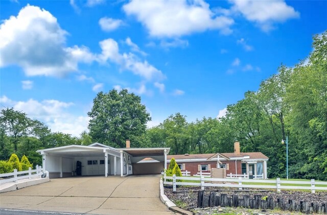 427 Harpers Ferry Rd, North Sewickley Twp, PA 15010 - ranch-style home featuring a chimney, a detached garage, view of wooded area, and brick siding