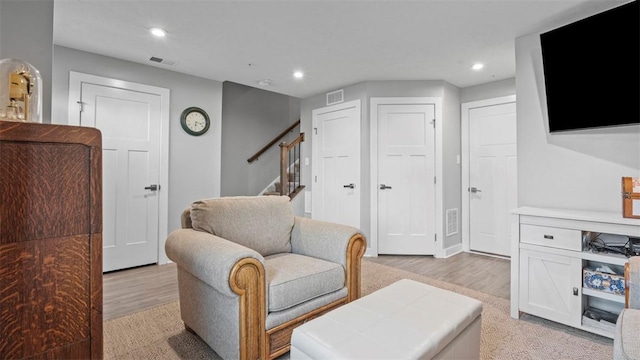 155 Bucktail Dr, Cranberry Twp, PA 16066 - living room with light wood-style flooring, recessed lighting, stairs, and baseboards