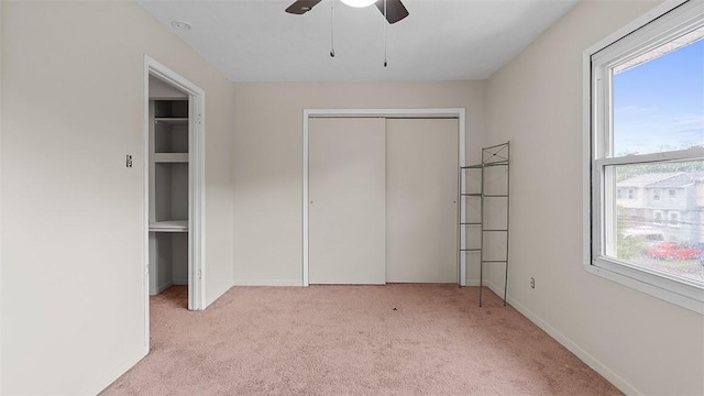40 Meanor St, Findlay Twp, PA 15126 - unfurnished bedroom with light carpet, multiple windows, a closet, and a ceiling fan