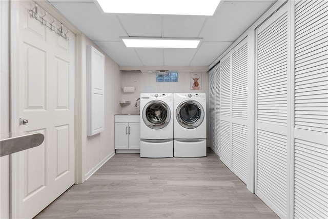 221 Moody Rd, Imperial, PA 15126 - laundry room featuring washer and dryer, cabinet space, and light wood-style floors