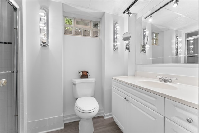 221 Moody Rd, Imperial, PA 15126 - full bathroom featuring vanity, toilet, wood finished floors, and a tile shower