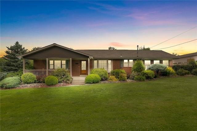 221 Moody Rd, Imperial, PA 15126 - ranch-style house with brick siding, a front lawn, and a porch
