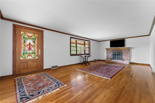 221 Moody Rd, Imperial, PA 15126 - unfurnished living room with ornamental molding, wood finished floors, baseboards, and a fireplace