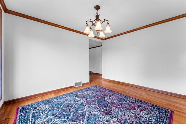 221 Moody Rd, Imperial, PA 15126 - unfurnished room featuring a chandelier, crown molding, wood finished floors, and baseboards