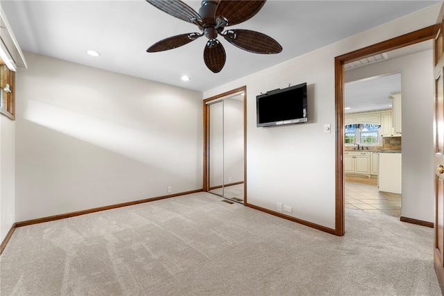 221 Moody Rd, Imperial, PA 15126 - unfurnished bedroom with light colored carpet, a closet, baseboards, recessed lighting, and a sink