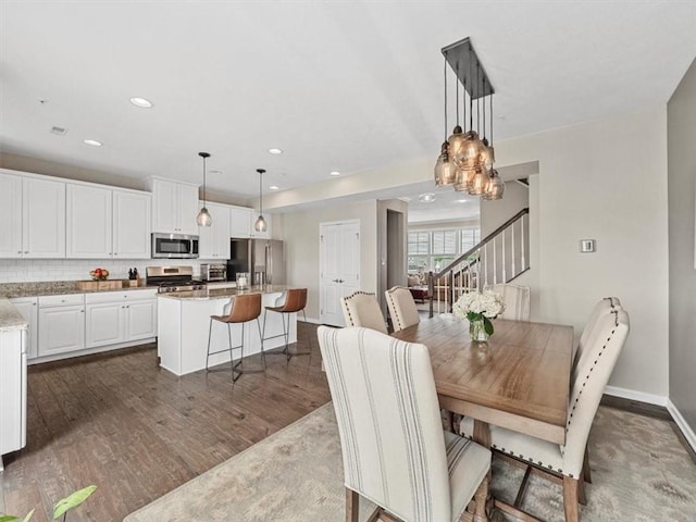 4046 Overview Dr, Cecil, PA 15317 - dining area featuring dark wood-type flooring, baseboards, stairway, recessed lighting, and a chandelier