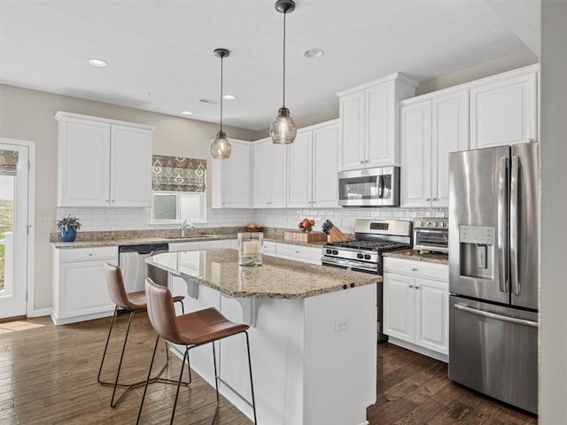 4046 Overview Dr, Cecil, PA 15317 - kitchen featuring stainless steel appliances, a sink, backsplash, white cabinetry, and recessed lighting