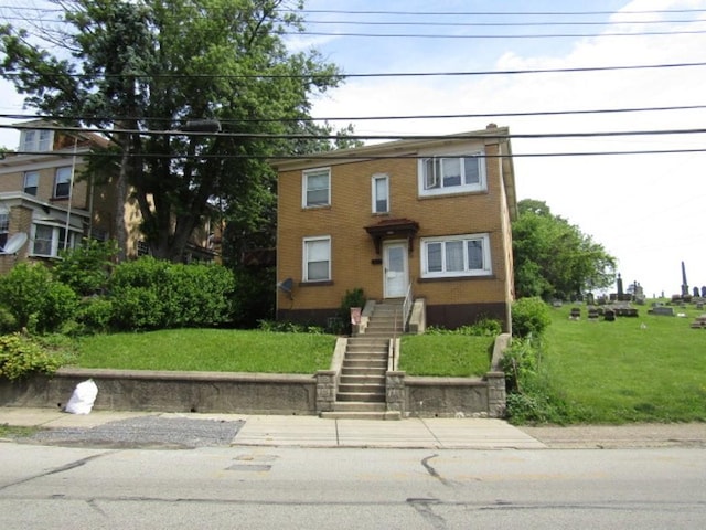 2445 Brownsville Rd, Carrick, PA 15210 - multi unit property with a front yard, brick siding, and stairs