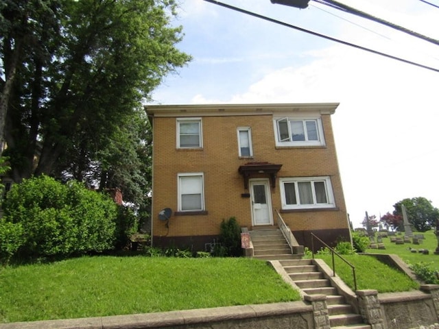 2445 Brownsville Rd, Carrick, PA 15210 - view of front of house featuring brick siding and a front lawn