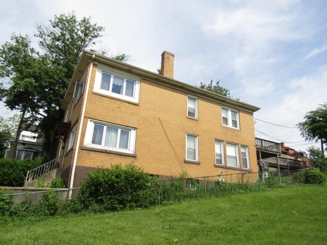 2445 Brownsville Rd, Carrick, PA 15210 - rear view of property featuring a chimney and brick siding