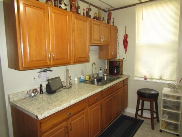 2445 Brownsville Rd, Carrick, PA 15210 - kitchen featuring a sink and brown cabinetry