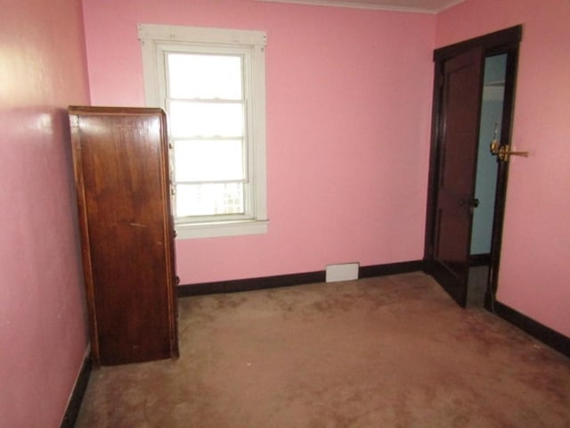 2445 Brownsville Rd, Carrick, PA 15210 - carpeted spare room featuring baseboards and crown molding