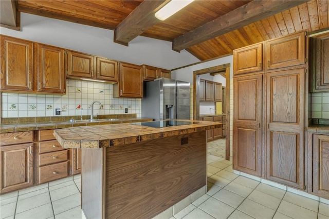 1369 Old Pulaski Rd, Neshannock Twp, PA 16105 - kitchen with stainless steel fridge, a sink, wooden ceiling, black electric stovetop, and backsplash