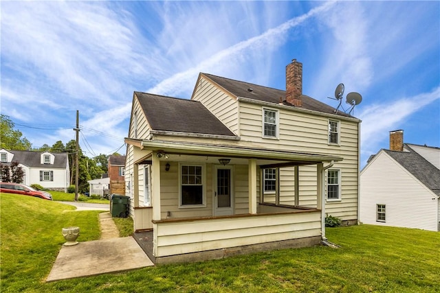 512 Pine Ave, Ellwood City Law, PA 16117 - rear view of property with a yard and a chimney