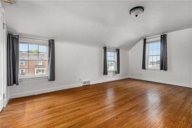 512 Pine Ave, Ellwood City Law, PA 16117 - additional living space with lofted ceiling, wood-type flooring, plenty of natural light, and baseboards