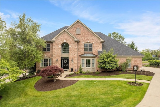 409 Foxwood Ln, Scott Twp Sal, PA 15220 - view of front of property with a front yard, brick siding, and roof with shingles
