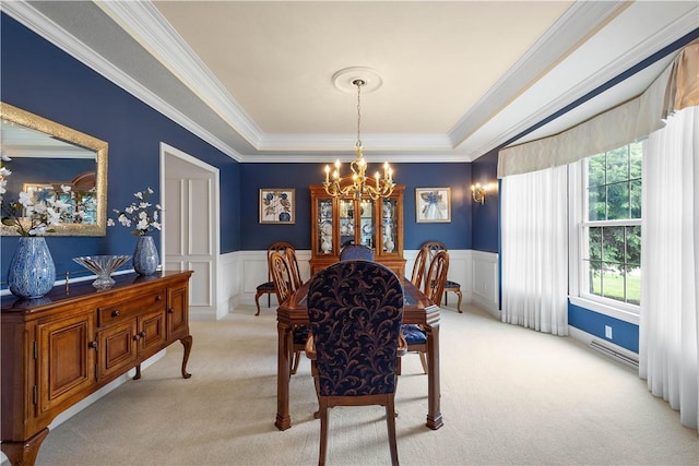 409 Foxwood Ln, Scott Twp Sal, PA 15220 - dining space with a chandelier, light colored carpet, ornamental molding, wainscoting, and a tray ceiling