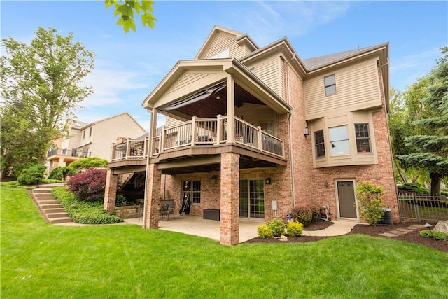409 Foxwood Ln, Scott Twp Sal, PA 15220 - rear view of house featuring a patio, a lawn, brick siding, and a balcony