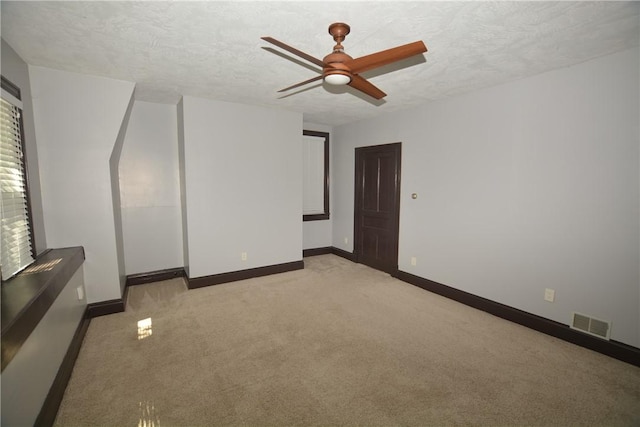 3640 Massachusetts Ave, Brighton Heights, PA 15212 - carpeted spare room with a ceiling fan, baseboards, and a textured ceiling