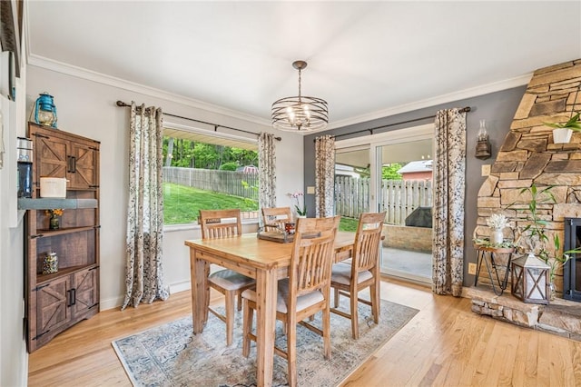 124 Hilton Rd, Unity Twp, PA 15601 - dining room with a chandelier, plenty of natural light, crown molding, and light wood-type flooring