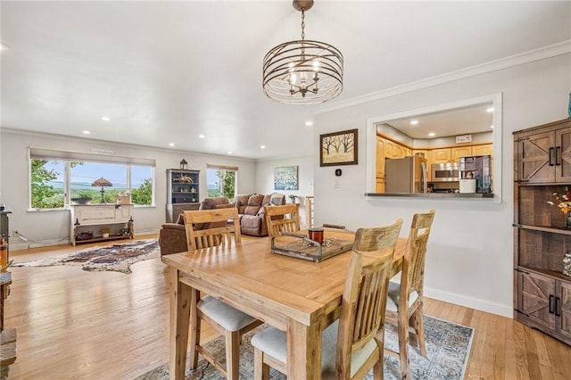 124 Hilton Rd, Unity Twp, PA 15601 - dining space featuring a chandelier, ornamental molding, plenty of natural light, light wood-type flooring, and baseboards