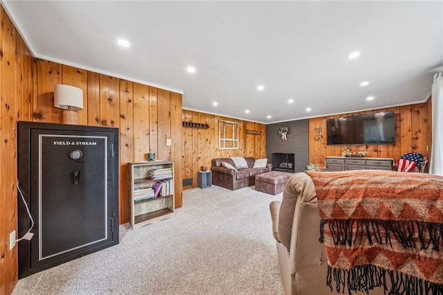 124 Hilton Rd, Unity Twp, PA 15601 - carpeted living area with wood walls, recessed lighting, crown molding, and a brick fireplace