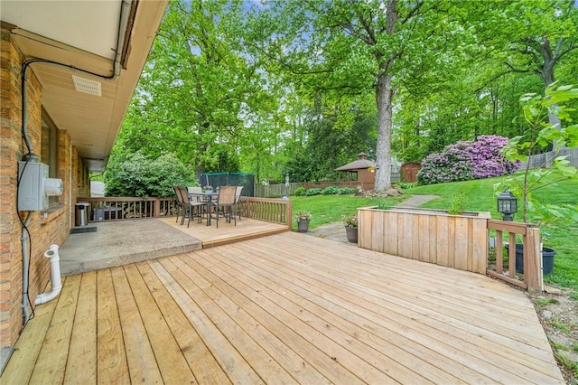 124 Hilton Rd, Unity Twp, PA 15601 - deck featuring outdoor dining area and view of wooded area