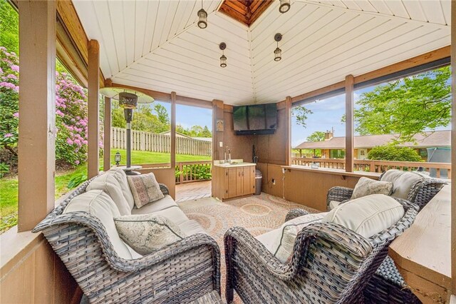 124 Hilton Rd, Unity Twp, PA 15601 - sunroom / solarium with healthy amount of natural light, vaulted ceiling, and outdoor lounge area