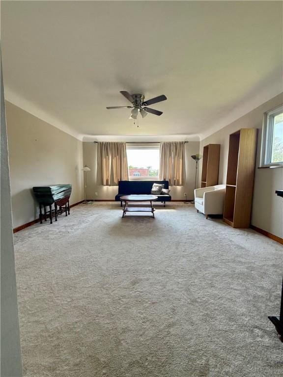 217 Crescent Dr, Hempfield Twp Wml, PA 15601 - carpeted living area with a ceiling fan and baseboards