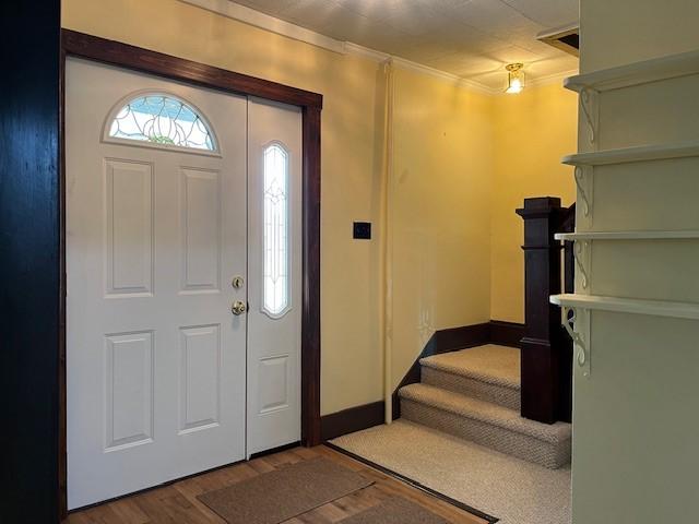 446 Sugar Maple Dr, Windber, PA 15963 - foyer with wood finished floors, crown molding, stairway, and baseboards