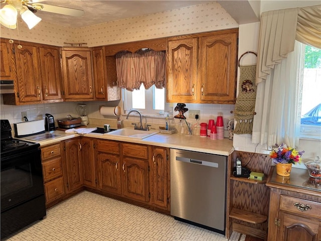 2122 Elizabeth Ct, Export, PA 15632 - kitchen with dishwasher, black electric range, a sink, and brown cabinets