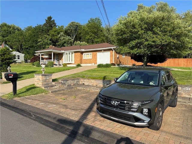 2122 Elizabeth Ct, Export, PA 15632 - ranch-style home with covered porch, brick siding, and an attached garage