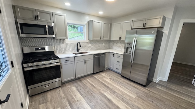 14 Haywood St, Carroll Twp, PA 15063 - kitchen featuring stainless steel appliances, a sink, gray cabinets, light wood-type flooring, and recessed lighting