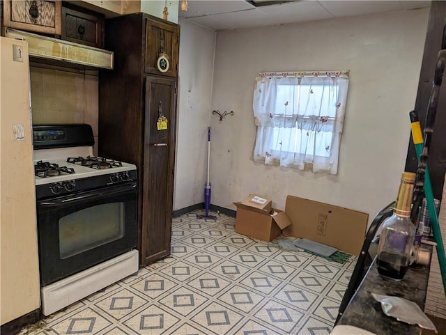 1321-1323 Bingham St, South Side, PA 15203 - kitchen featuring black gas stove, dark brown cabinetry, ventilation hood, and a drop ceiling