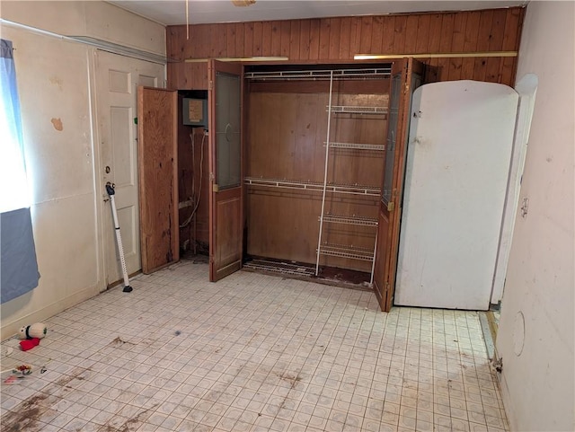 1321-1323 Bingham St, South Side, PA 15203 - unfurnished room featuring wood walls, baseboards, and light floors