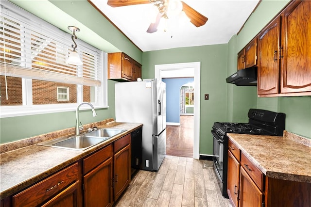 8 Robertson Pl, Etna, PA 15223 - kitchen featuring black appliances, a sink, under cabinet range hood, light wood-type flooring, and a ceiling fan
