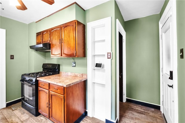8 Robertson Pl, Etna, PA 15223 - kitchen with black gas stove, ventilation hood, light countertops, and brown cabinets