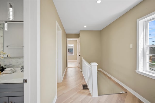 362 Marshall Ave, Observatory Hill, PA 15214 - hallway featuring an upstairs landing, a sink, plenty of natural light, baseboards, and recessed lighting