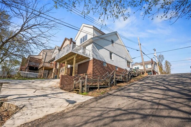 362 Marshall Ave, Observatory Hill, PA 15214 - view of home's exterior with concrete driveway, stairway, and a deck
