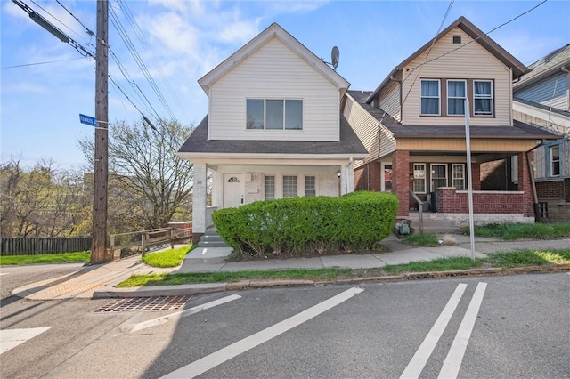 362 Marshall Ave, Observatory Hill, PA 15214 - view of front of home featuring covered porch, brick siding, and uncovered parking