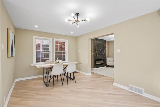 362 Marshall Ave, Observatory Hill, PA 15214 - dining area with light wood-type flooring, a chandelier, baseboards, a high end fireplace, and recessed lighting