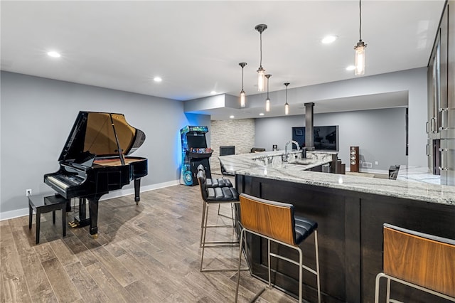 1575 Parkview Blvd, Squirrel Hill, PA 15217 - kitchen featuring wood finished floors, light stone countertops, baseboards, open floor plan, and recessed lighting
