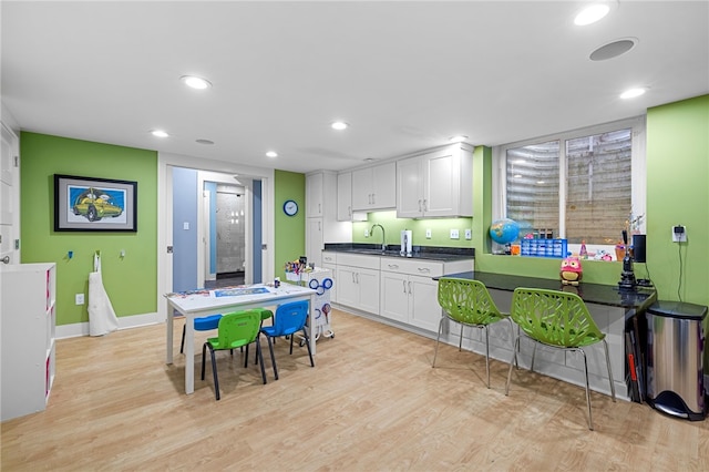 1575 Parkview Blvd, Squirrel Hill, PA 15217 - kitchen featuring light wood-style floors, white cabinetry, dark countertops, a sink, and recessed lighting
