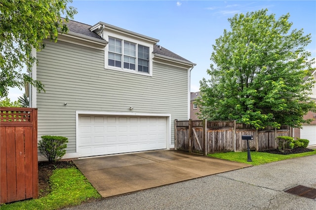 1575 Parkview Blvd, Squirrel Hill, PA 15217 - view of side of property featuring a garage, a shingled roof, and driveway