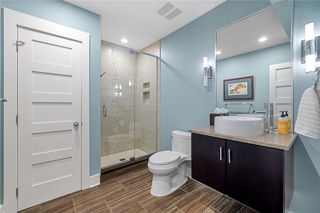 1575 Parkview Blvd, Squirrel Hill, PA 15217 - full bath with toilet, vanity, a shower stall, recessed lighting, and wood finish floors