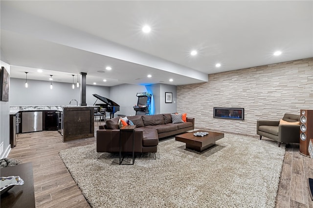 1575 Parkview Blvd, Squirrel Hill, PA 15217 - living area with light wood-type flooring, recessed lighting, a glass covered fireplace, and bar area