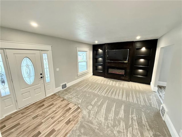 407 E Hillcrest Ave, New Castle/2Nd, PA 16105 - foyer with baseboards, wood finished floors, and a glass covered fireplace