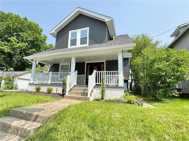 407 E Hillcrest Ave, New Castle/2Nd, PA 16105 - view of front of house featuring a porch, a front lawn, and a shingled roof