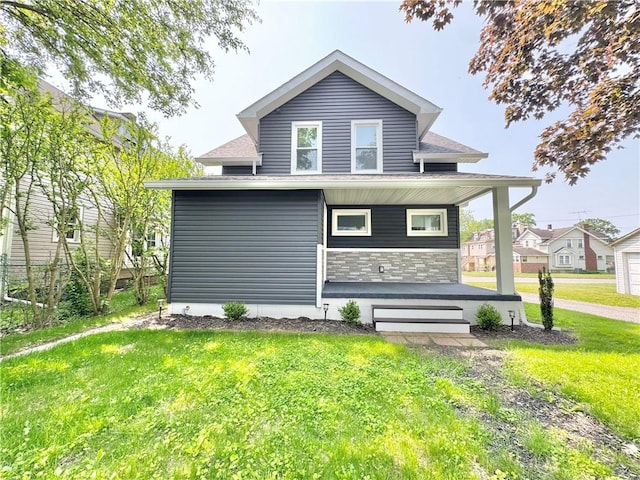 407 E Hillcrest Ave, New Castle/2Nd, PA 16105 - back of property with covered porch, a yard, and stone siding